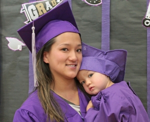 A Florence Crittenton mother graduating from high school and her child graduating from the early education childhood center