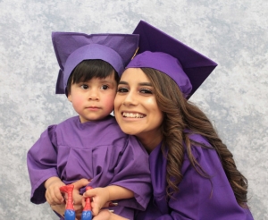 A Florence Crittenton mother graduating from high school and her child graduating from the early education childhood center